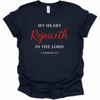 A navy blue short-sleeve t-shirt with a printed religious quote on the front reading 'MY HEART Rejoiceth IN THE LORD 1 SAMUEL 2:1' in white and red lettering, shown against a plain white background.
