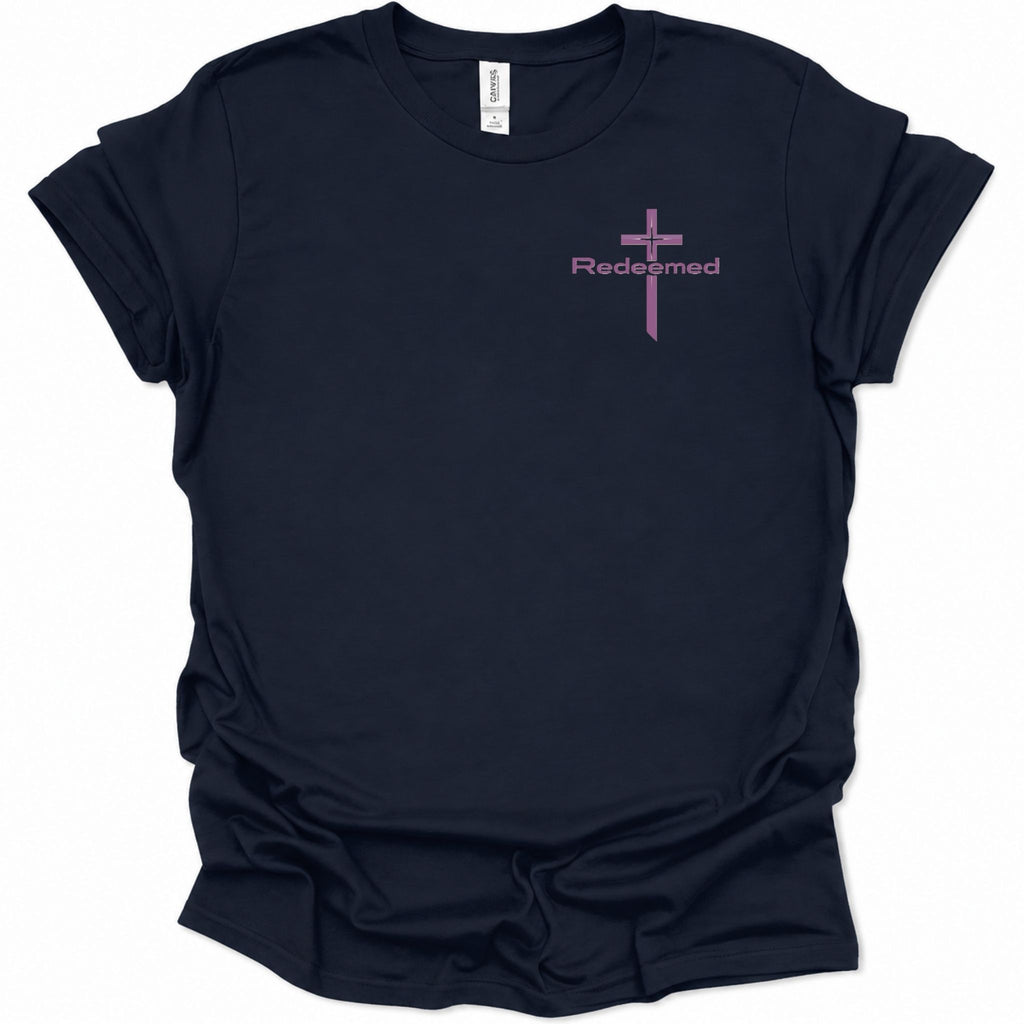 A navy blue short-sleeve t-shirt with a small pink graphic on the left chest featuring a cross and the word 'Redempted'.