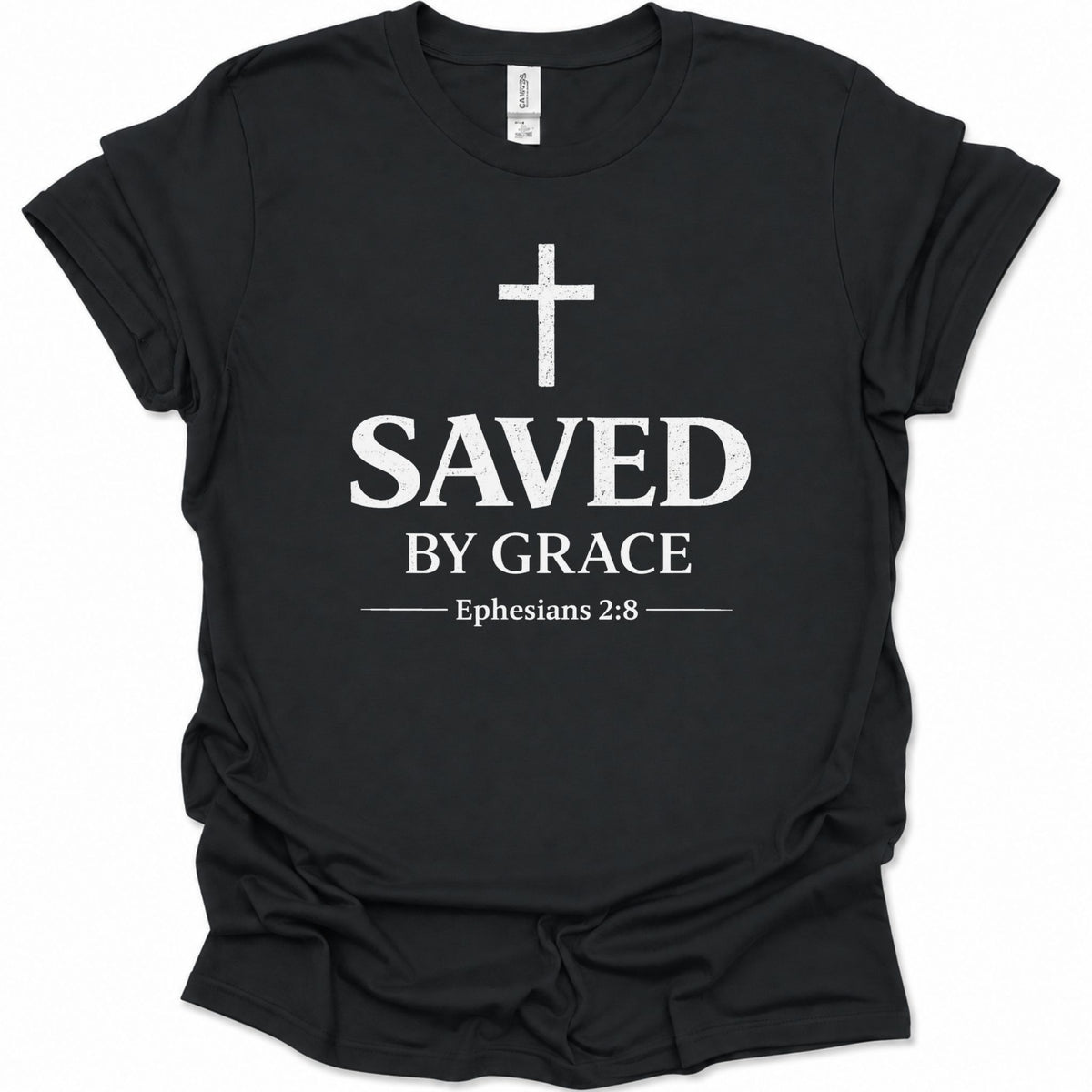 A black short-sleeve crewneck t-shirt with a distressed white graphic print on the front featuring a cross, the word 'SAVED', 'BY GRACE', and the Bible verse 'Ephesians 2:8'.