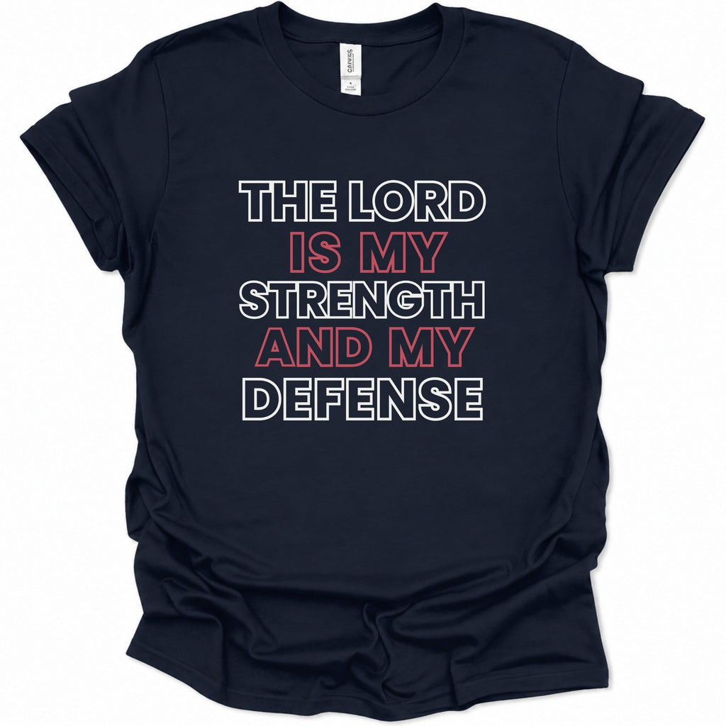 A navy blue short-sleeve t-shirt with a graphic text print reading 'THE LORD IS MY STRENGTH AND MY DEFENSE' in white and red lettering, displayed on a clean white background.