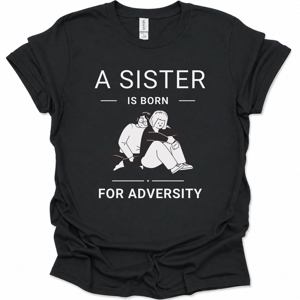 A black short-sleeve graphic T-shirt laid flat on a white background. The shirt features white printed text reading 'A SISTER IS BORN FOR ADVERSY' with a simple line drawing of two people sitting together in the center.