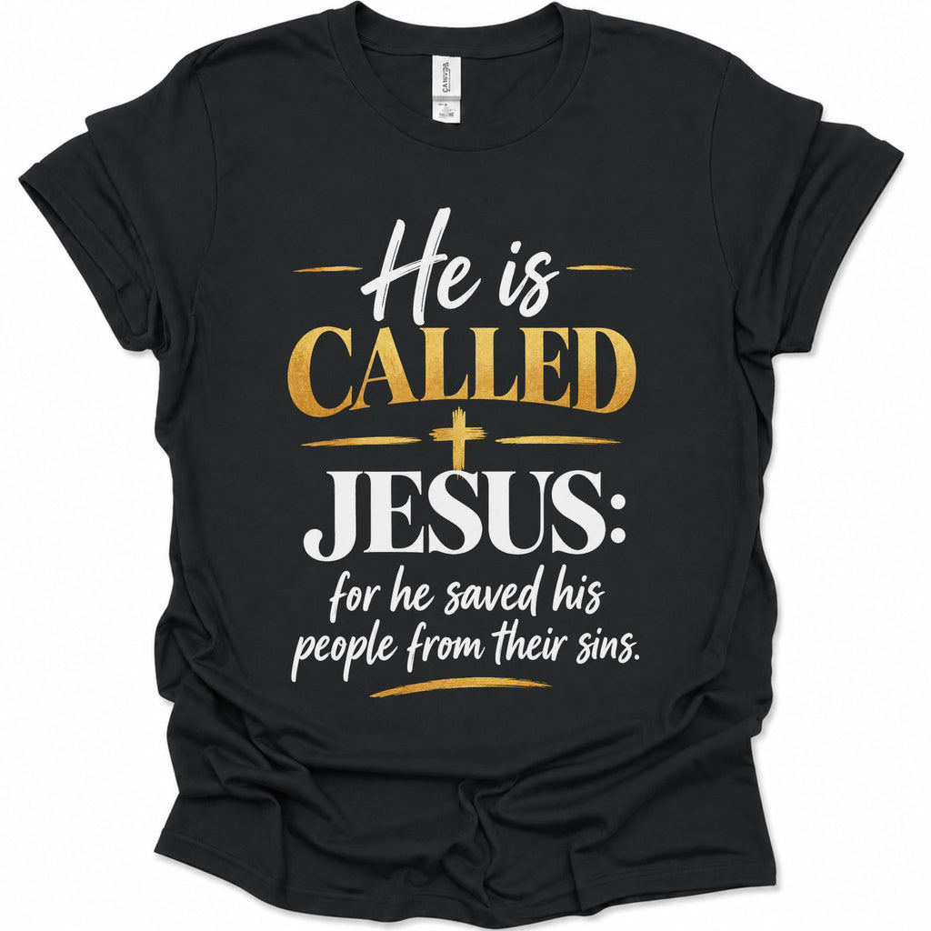 A black short-sleeve t-shirt with a graphic print on the front that reads 'He is CALLED JESUS: for he saved his people from their sins.' in white and gold lettering, displayed on a clean white background.