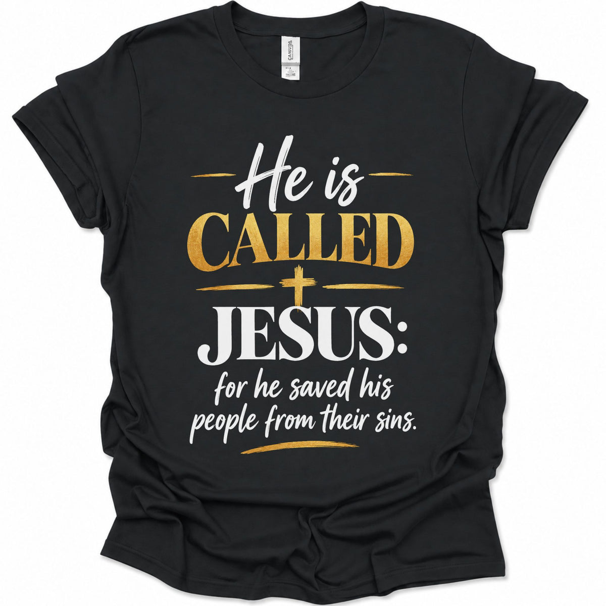 A black short-sleeve t-shirt with a graphic print on the front that reads 'He is CALLED JESUS: for he saved his people from their sins.' in white and gold lettering, displayed on a clean white background.