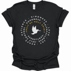 A black short-sleeve crewneck t-shirt with a circular graphic on the chest featuring a white dove and the words 'FRUIT OF HOLY SPIRIT' in yellow, surrounded by white words on a black background.
