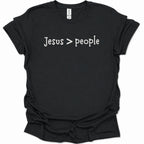 A black short-sleeve t-shirt with the phrase 'Jesus > people' printed in white across the chest, displayed against a plain white background.
