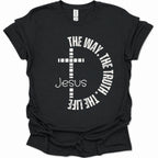 A black short-sleeve t-shirt with a white graphic print featuring a cross, the word 'Jesus', and the phrase 'THE WAY, THE TRUTH, THE LIFE' arranged in a circle.