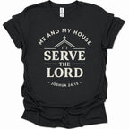 A black short-sleeve crewneck t-shirt with a cream-colored graphic print on the front. The graphic features a church silhouette, a cross, and the text 'ME AND MY HOUSE SERVE THE LORD - JOSHUA 24:15 -'.