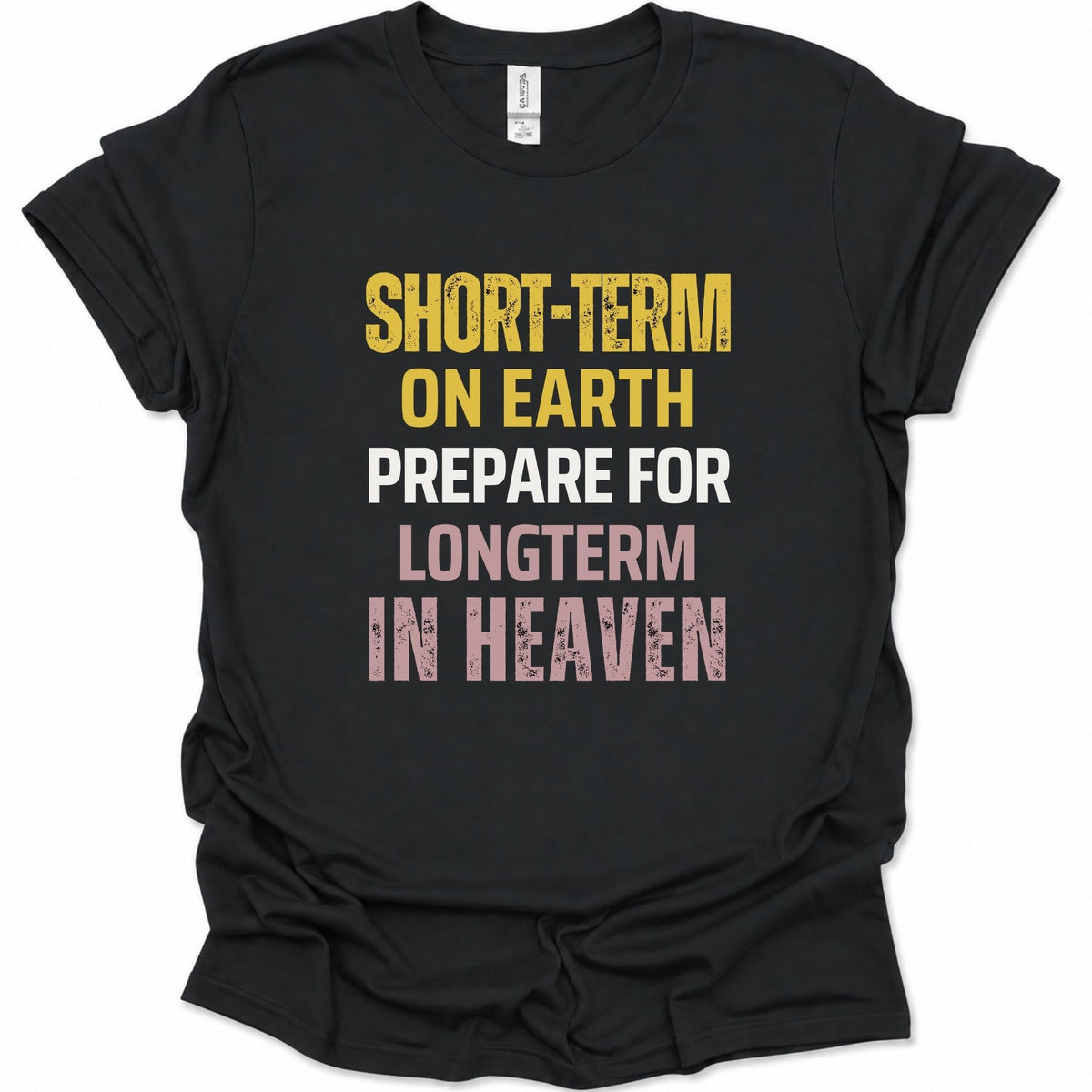 A black short-sleeve graphic T-shirt laid flat on a white background, featuring the phrase 'SHORT-TERM ON EARTH PREPARE FOR LONGTERM IN HEAVEN' in distressed yellow, white, and pink lettering.