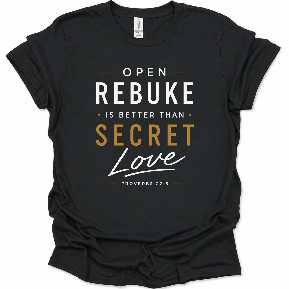 A black short-sleeve t-shirt with a graphic text print reading 'OPEN REBUKE IS BETTER THAN SECRET Love PROVERBS 27:5' in white and gold lettering, shown on a plain white background.