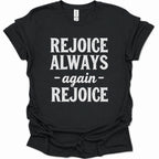 A black short-sleeve t-shirt with the phrase 'REJOICE ALWAYS -again- REJOICE' printed in bold white text on the front, displayed flat against a white background.