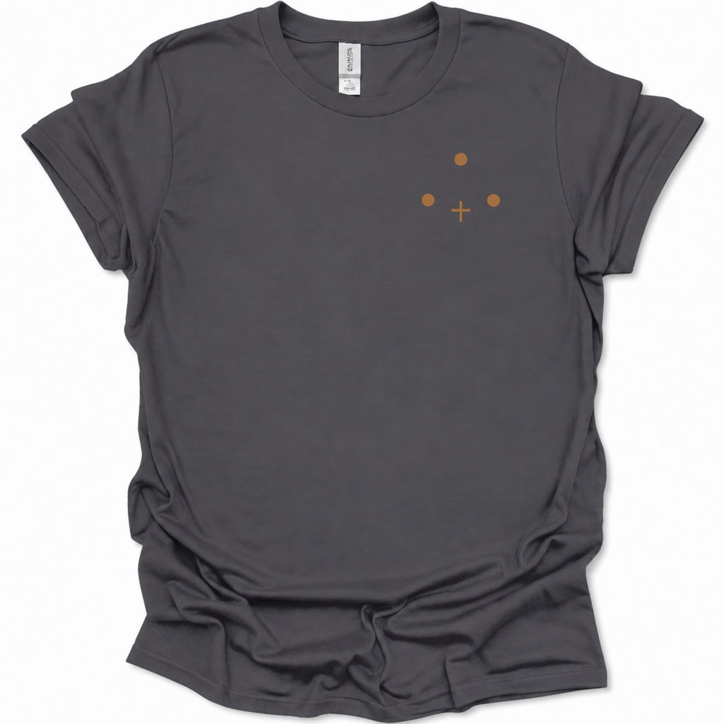 A dark heather gray short-sleeve t-shirt with a small orange graphic on the left chest consisting of three dots and a cross sign, displayed on a clean white background.