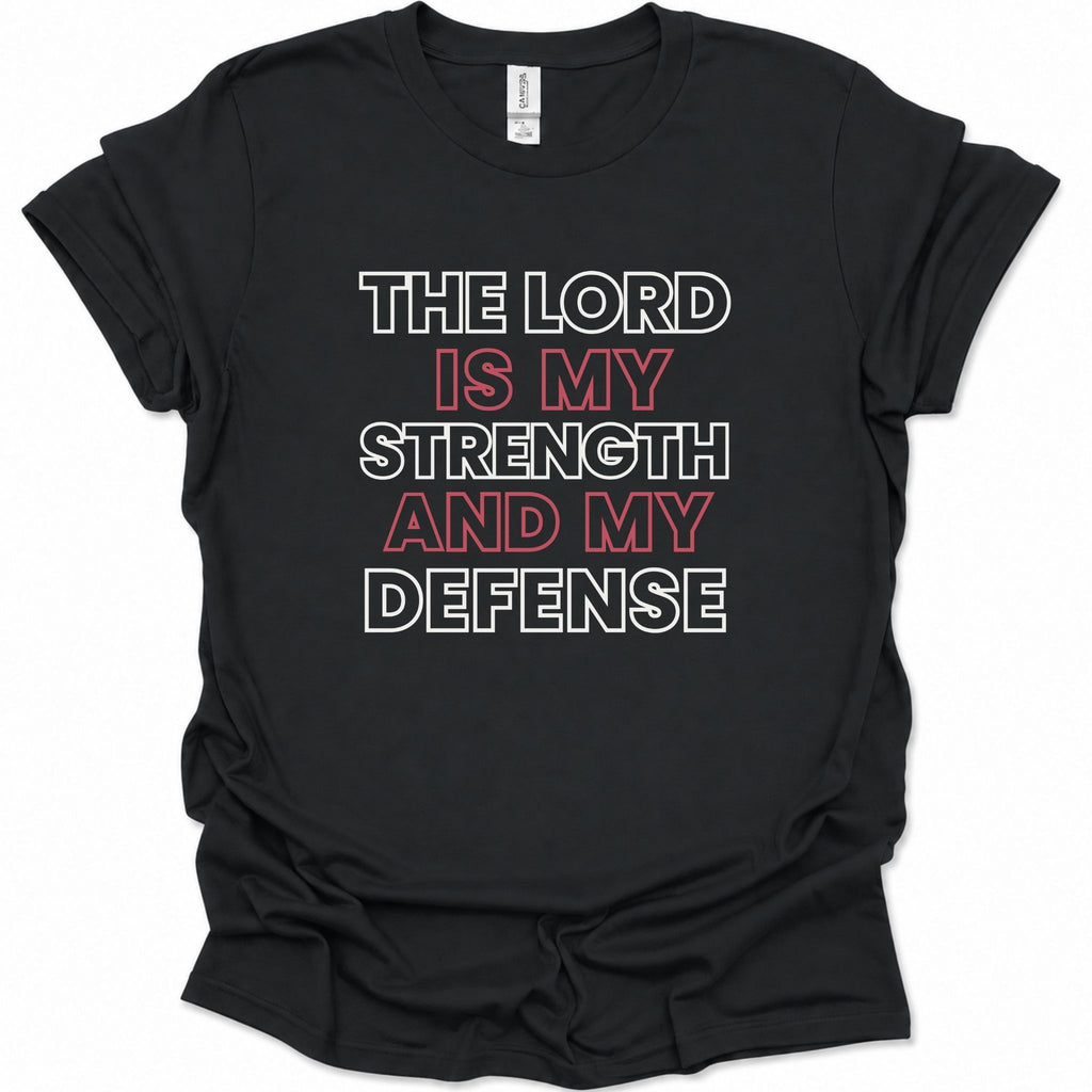 A black short-sleeve t-shirt with a graphic text print reading 'THE LORD IS MY STRENGTH AND MY DEFENSE' in white and red lettering, displayed on a clean white background.
