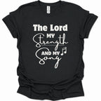 A black short-sleeve t-shirt with a white graphic print on the front reading 'The Lord My Strength And My Song' with a music note symbol, shown on a plain white background.