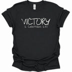A black short-sleeve t-shirt with 'VICTORY 2 CORINTHIANS 2:14' printed in white across the chest, displayed flat against a white background.