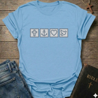 Light blue t-shirt with Biblical Relatable Symbols Christian T-Shirt faith apparel conversation starter on a wooden surface with jeans and a Bible.