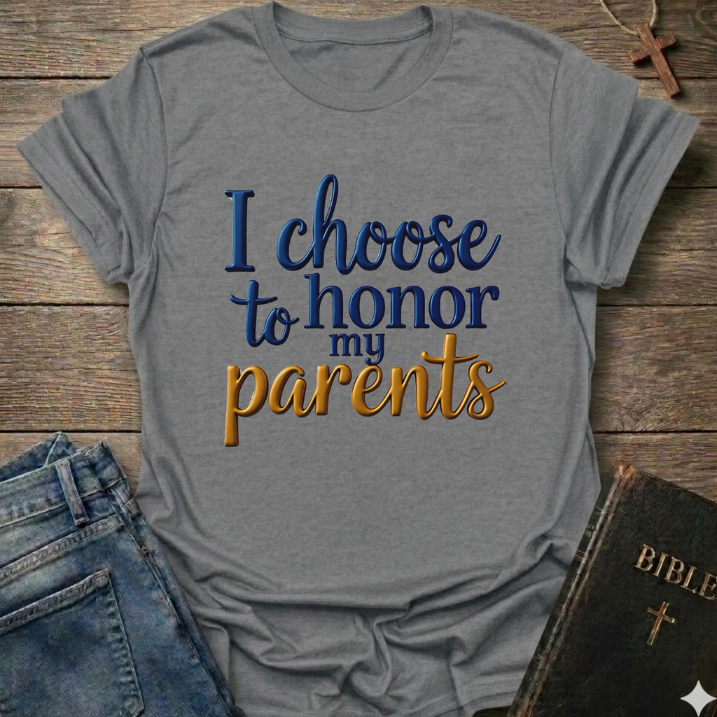 Gray t-shirt with 'I choose to honor my parents' Exodus 20:12 text navy gold Christian faith apparel conversation starter. T-shirt is on a wooden surface with jeans and a Bible.