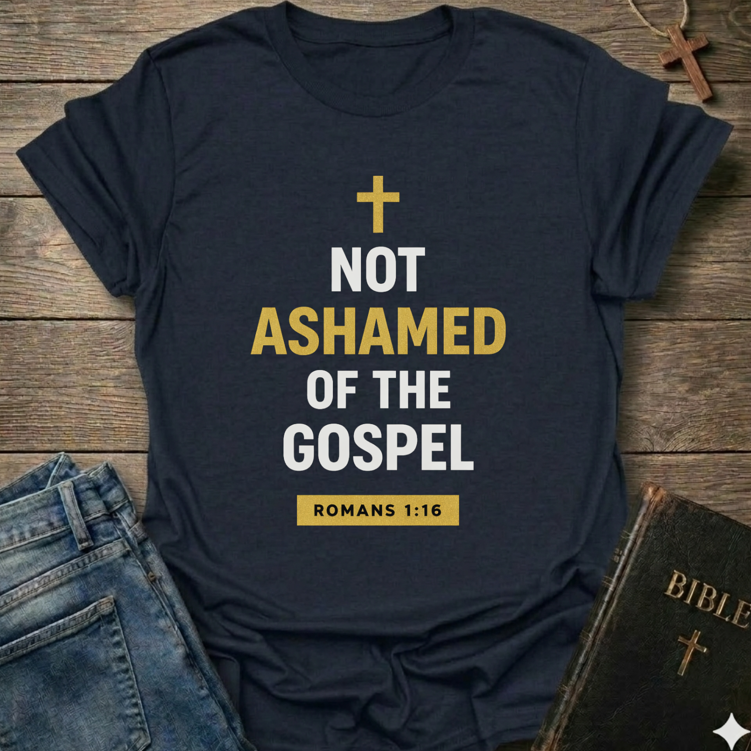 Navy blue t-shirt with 'Not Ashamed of the Gospel' text on a wooden surface with a Bible and cross. Christian T-Shirt Romans 1:16 bold faith apparel Faith Forward