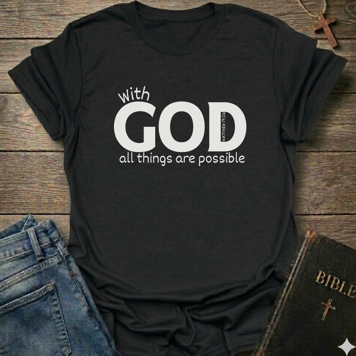 Black t-shirt with 'With GOD all things are possible' Matthew 19:26 bold faith apparel conversation starter
text on a wooden surface with jeans and a Bible.